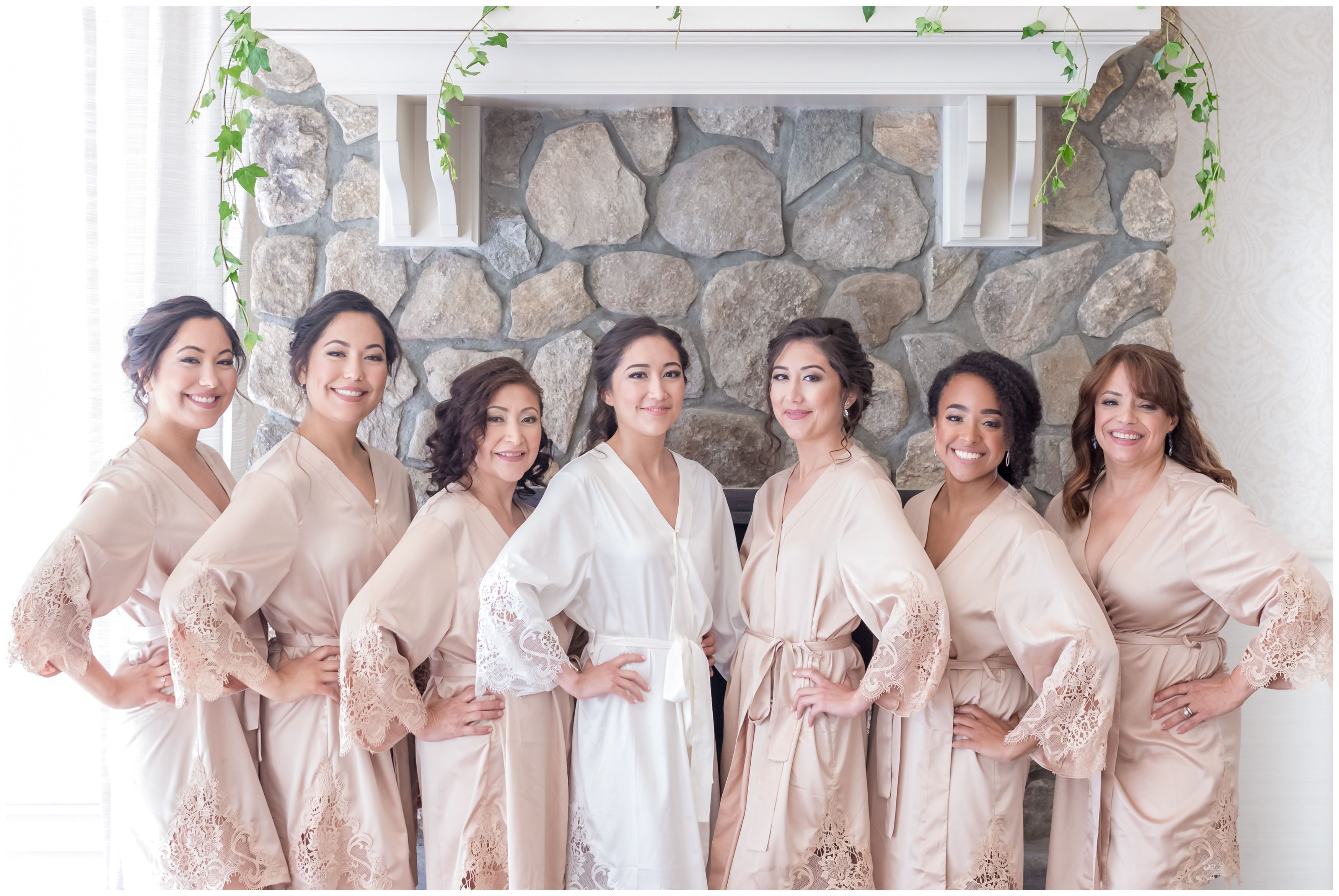 Bride and bridesmaids getting ready in bridal robes