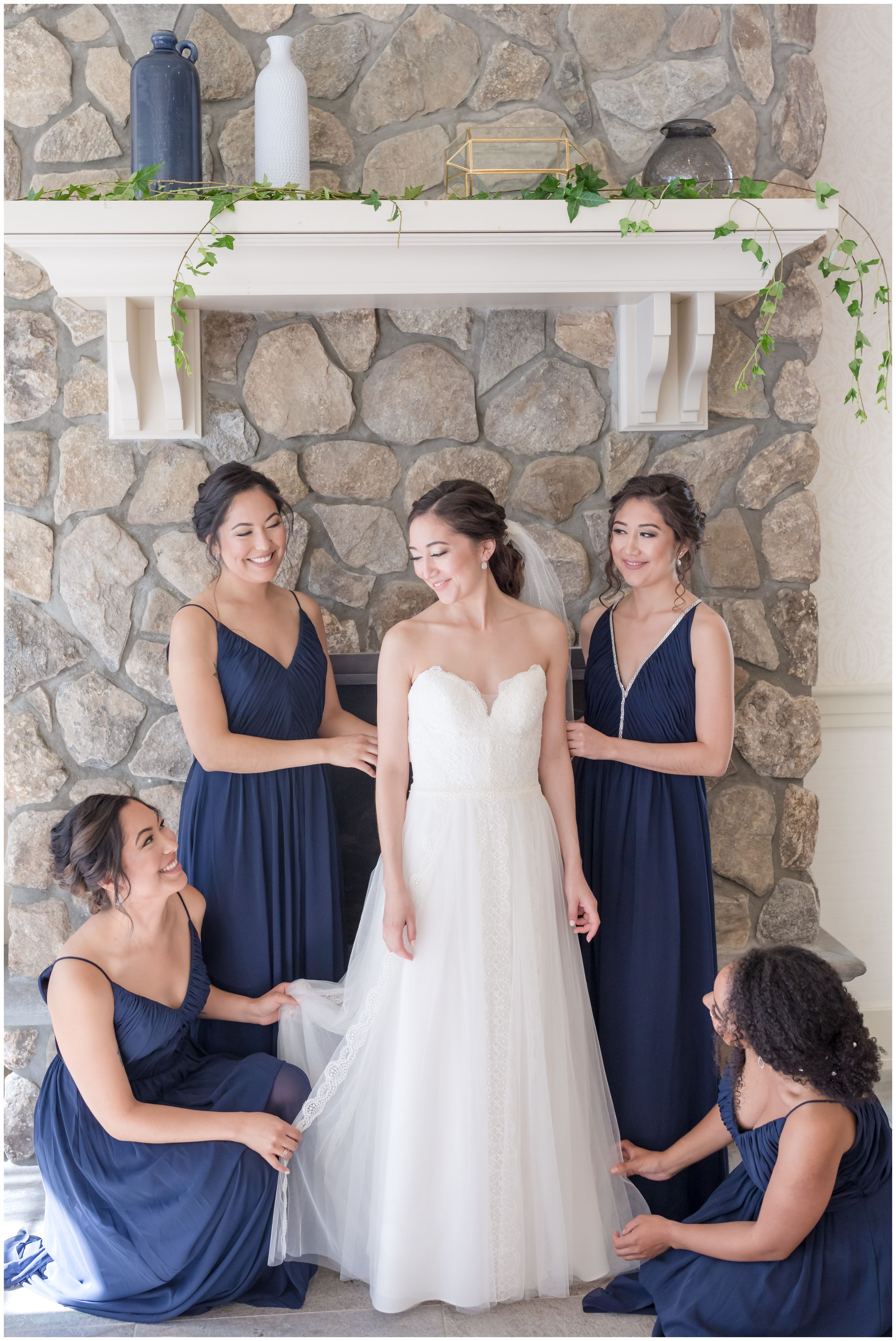 Bride getting ready with navy bridesmaids at Indian Trail Club