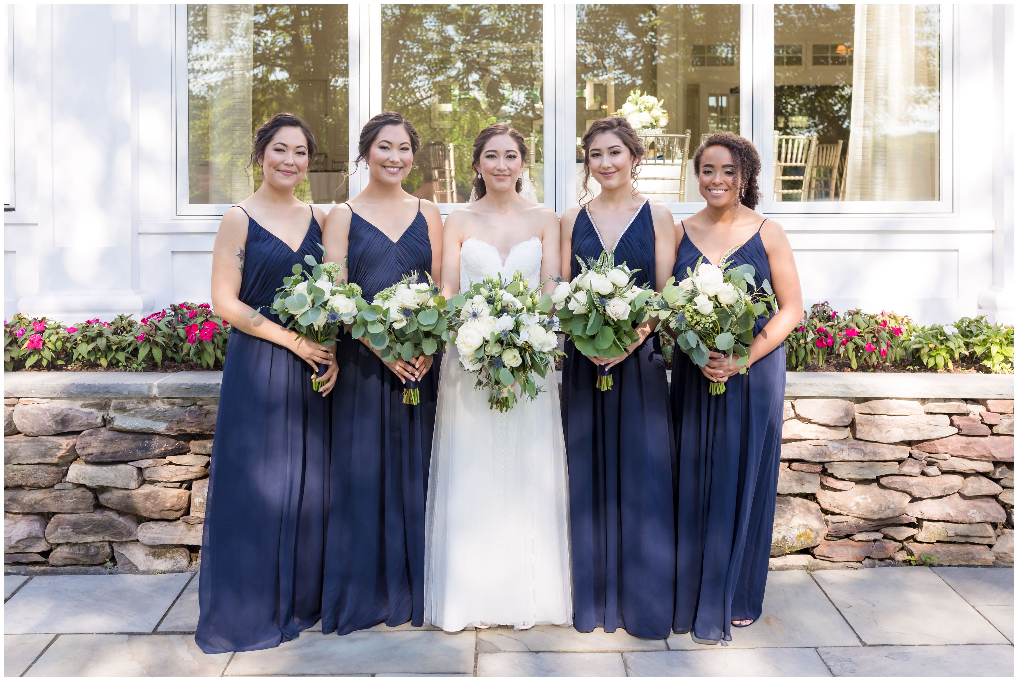Bridal Party at Indian Trail club with large white peonies and white roses bride bouquet with navy bridesmaids and white roses bouquets