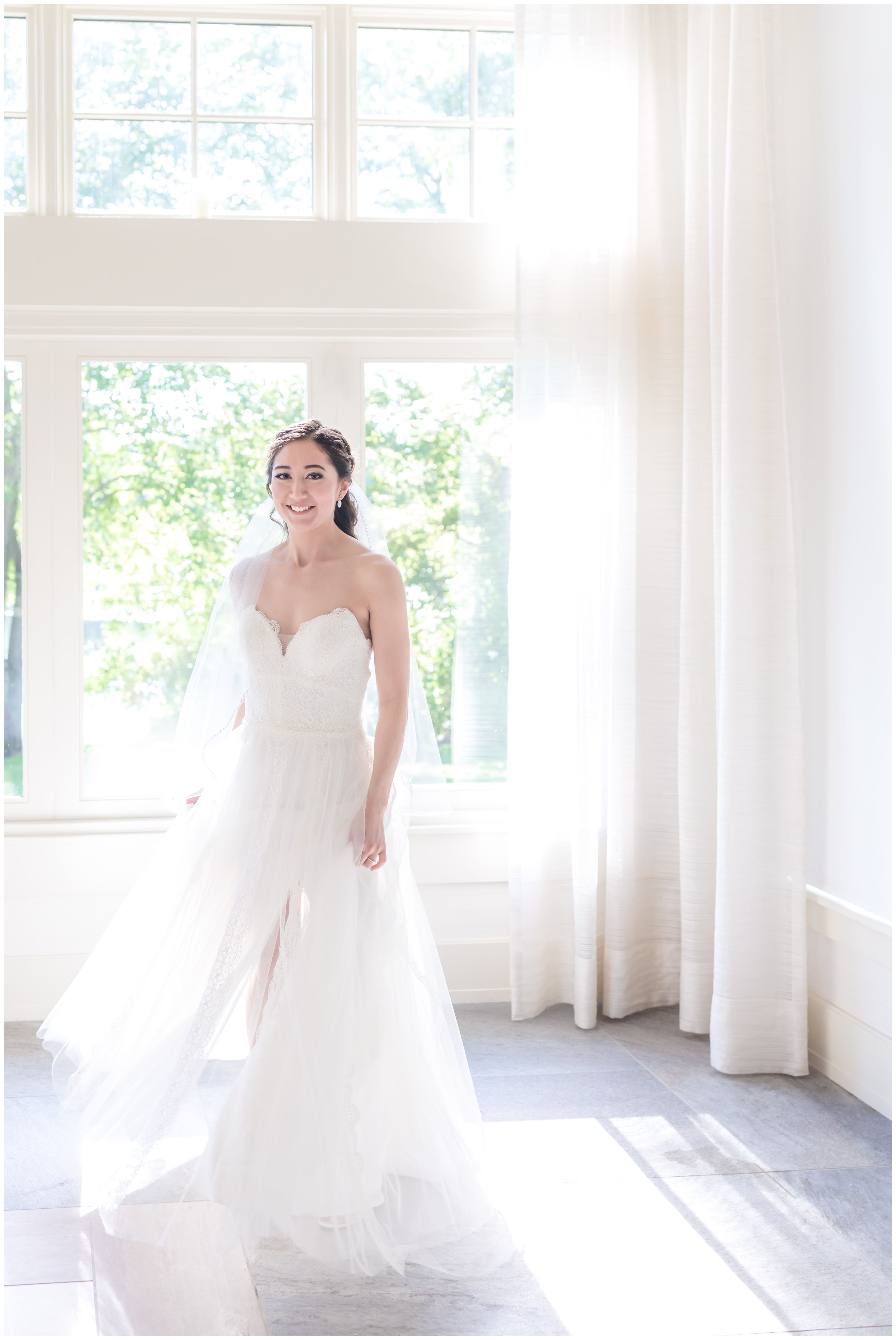 Bridal portrait in strapless tulle and lace wedding ballgown and classic veil at Indian Trail Club