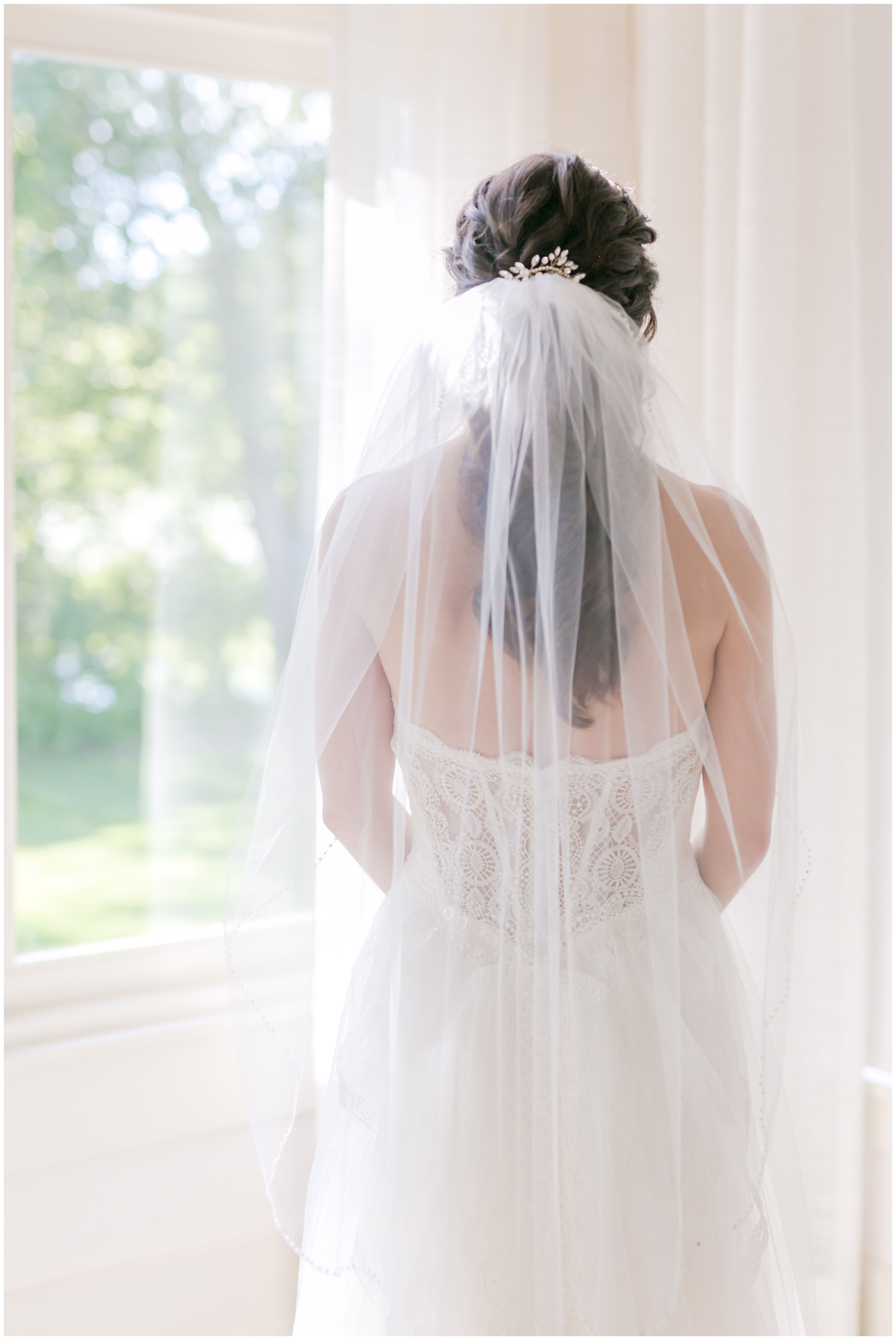 Classic veil bridal portrait with lace and tulle wedding ballgown