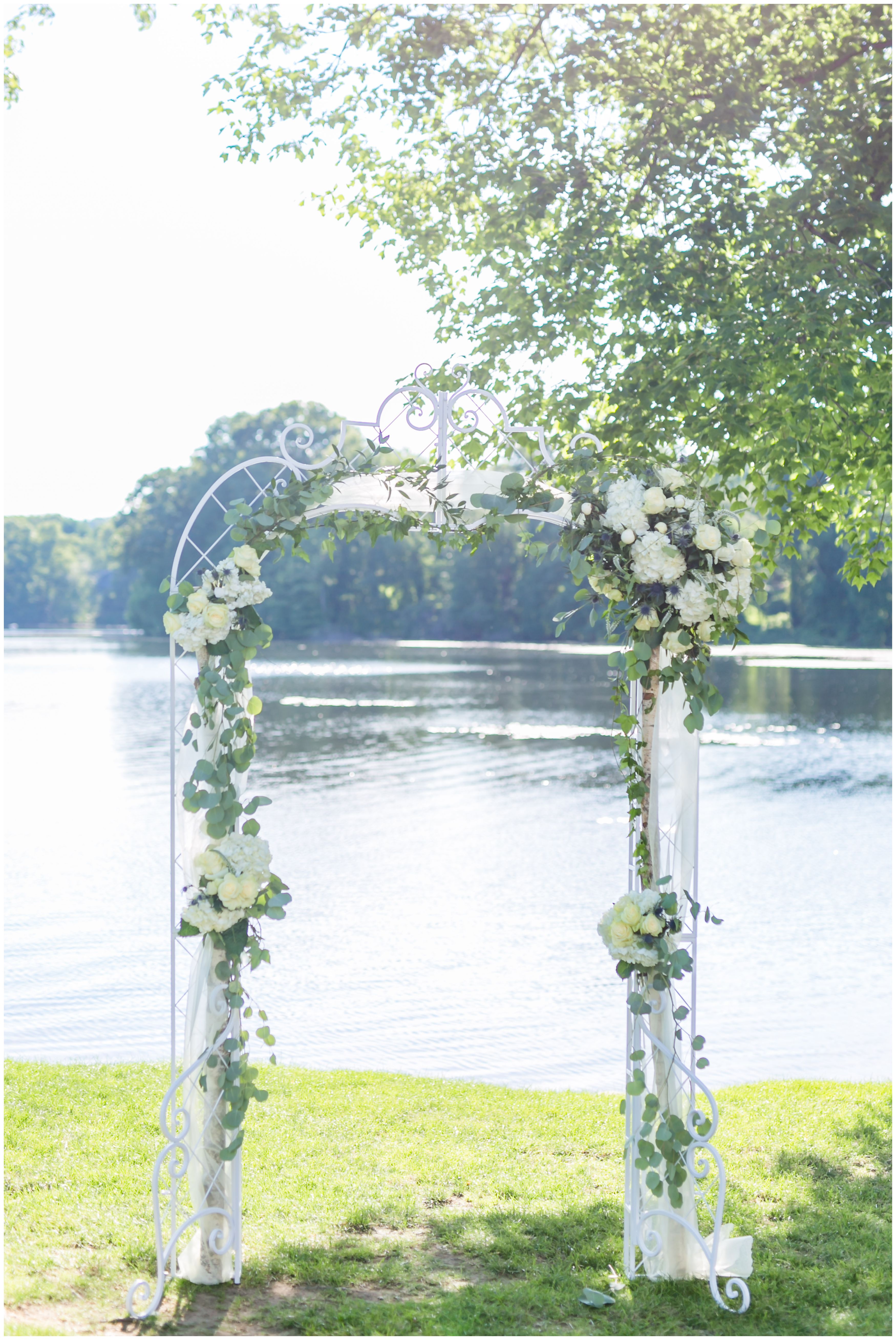 Lakeside Wedding Ceremony white flower arch at Indian Trail Club