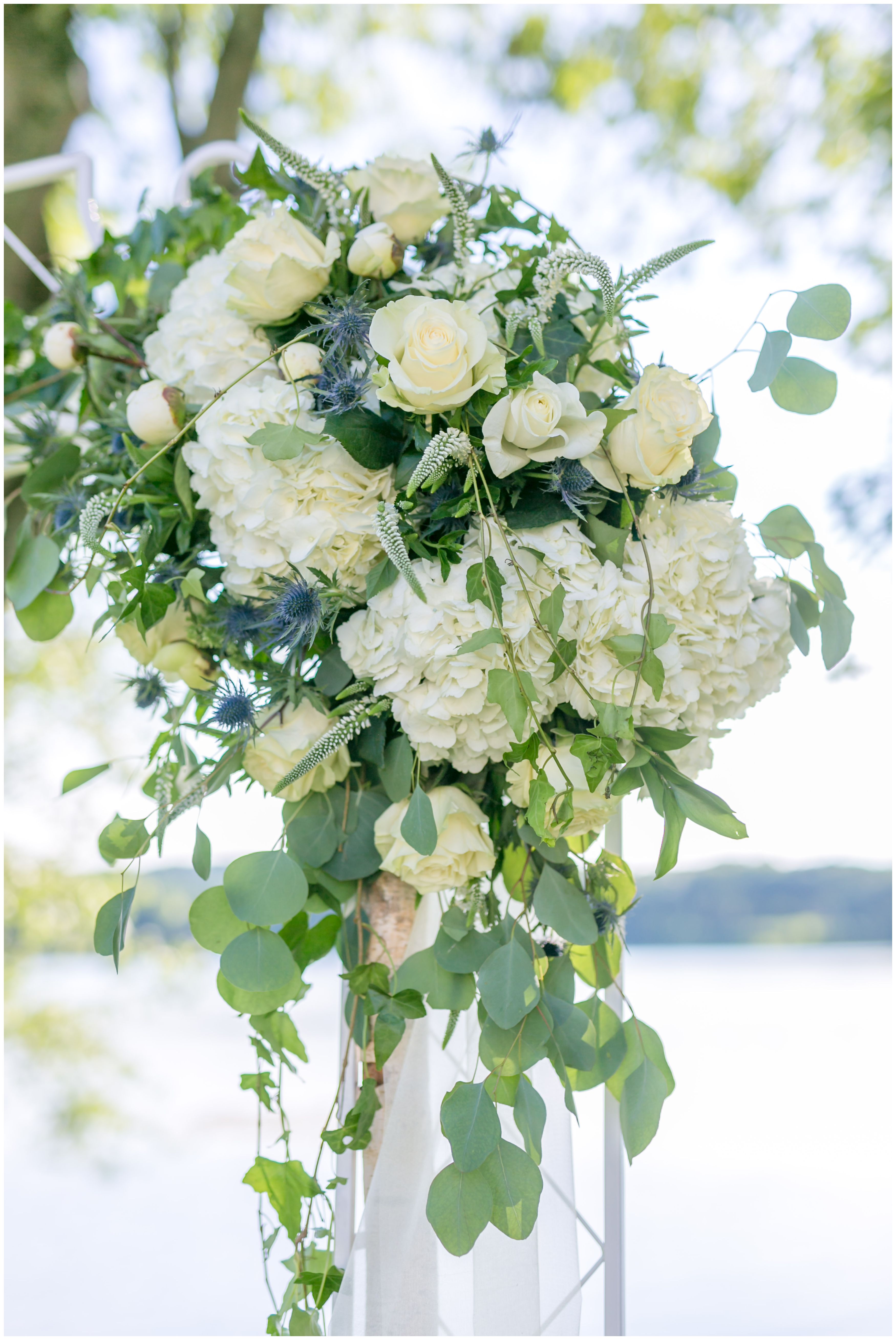 White hydrangea and rose ceremony arch detail