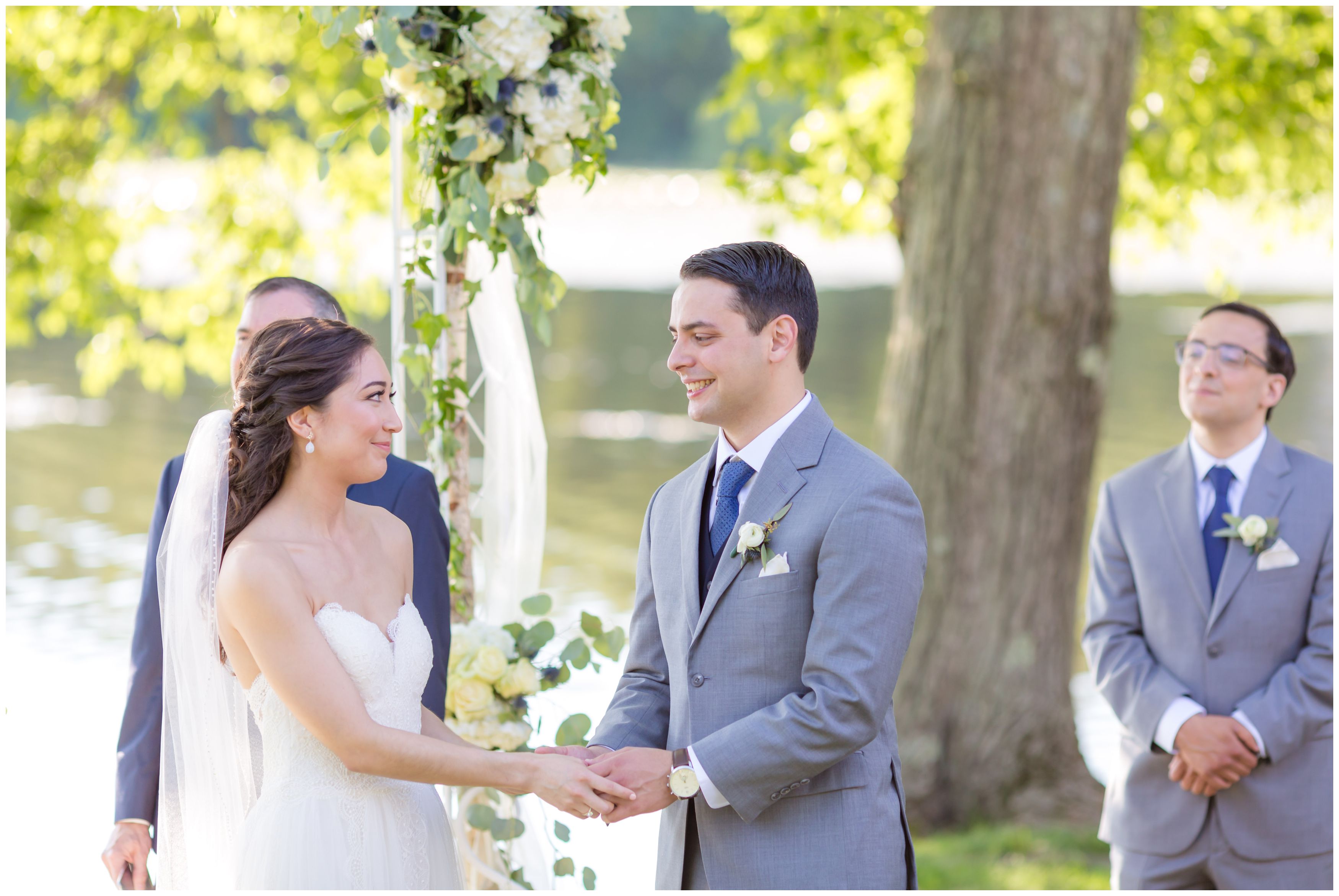 Bride and groom happy at outdoor lakeside ceremony
