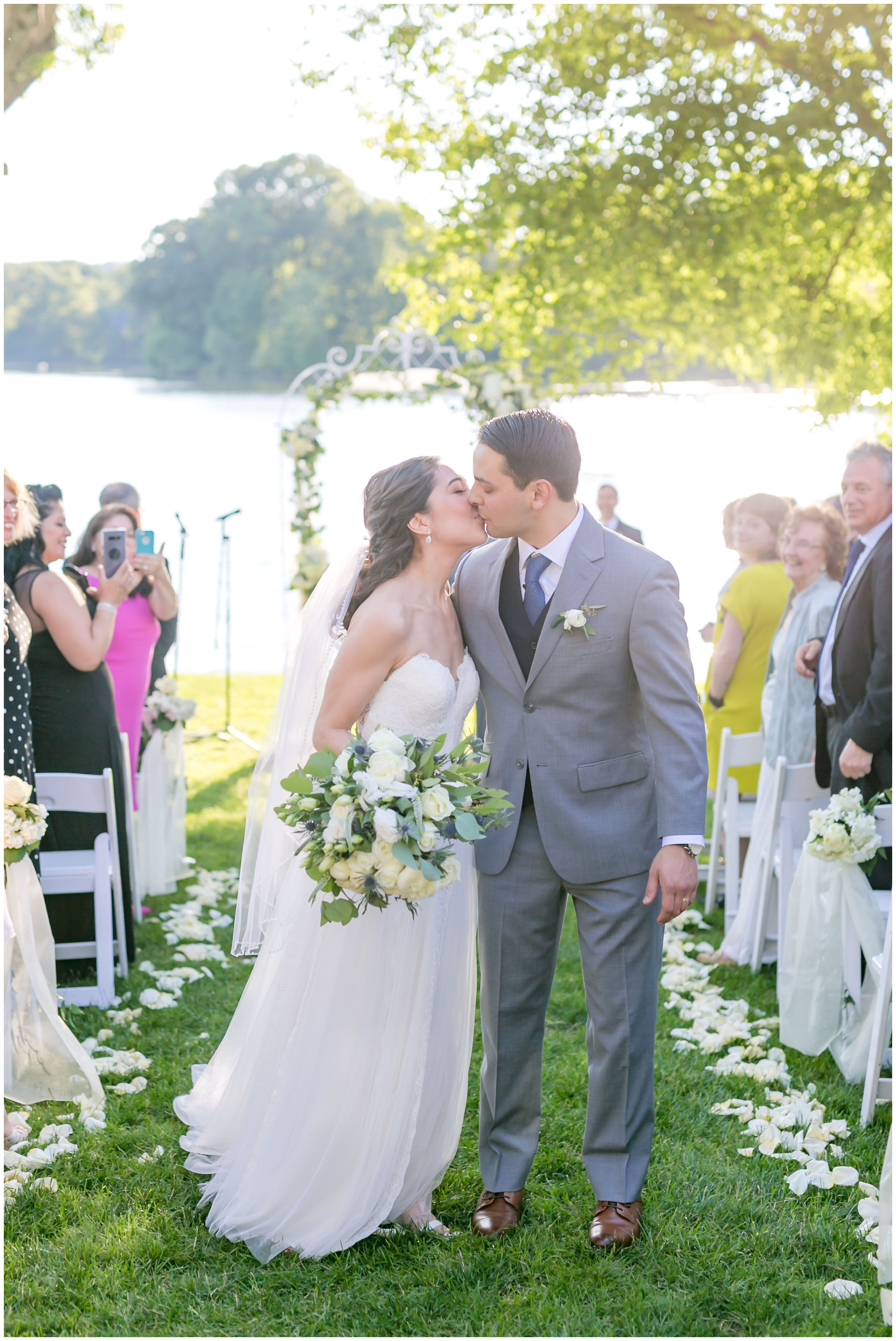 End of aisle ceremony kiss at Indian Trail Club