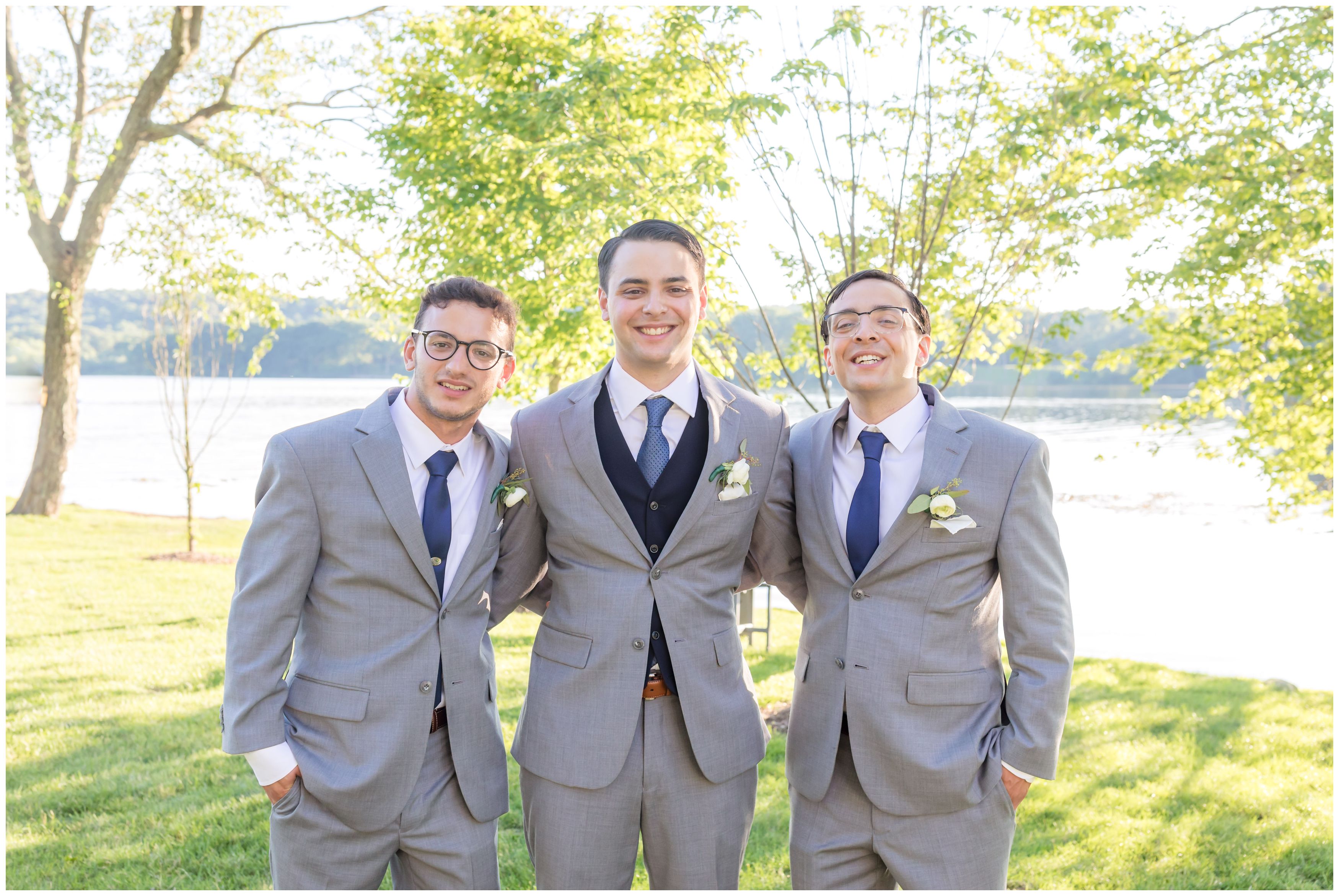 Groom and brothers family wedding photo outdoor lakeside