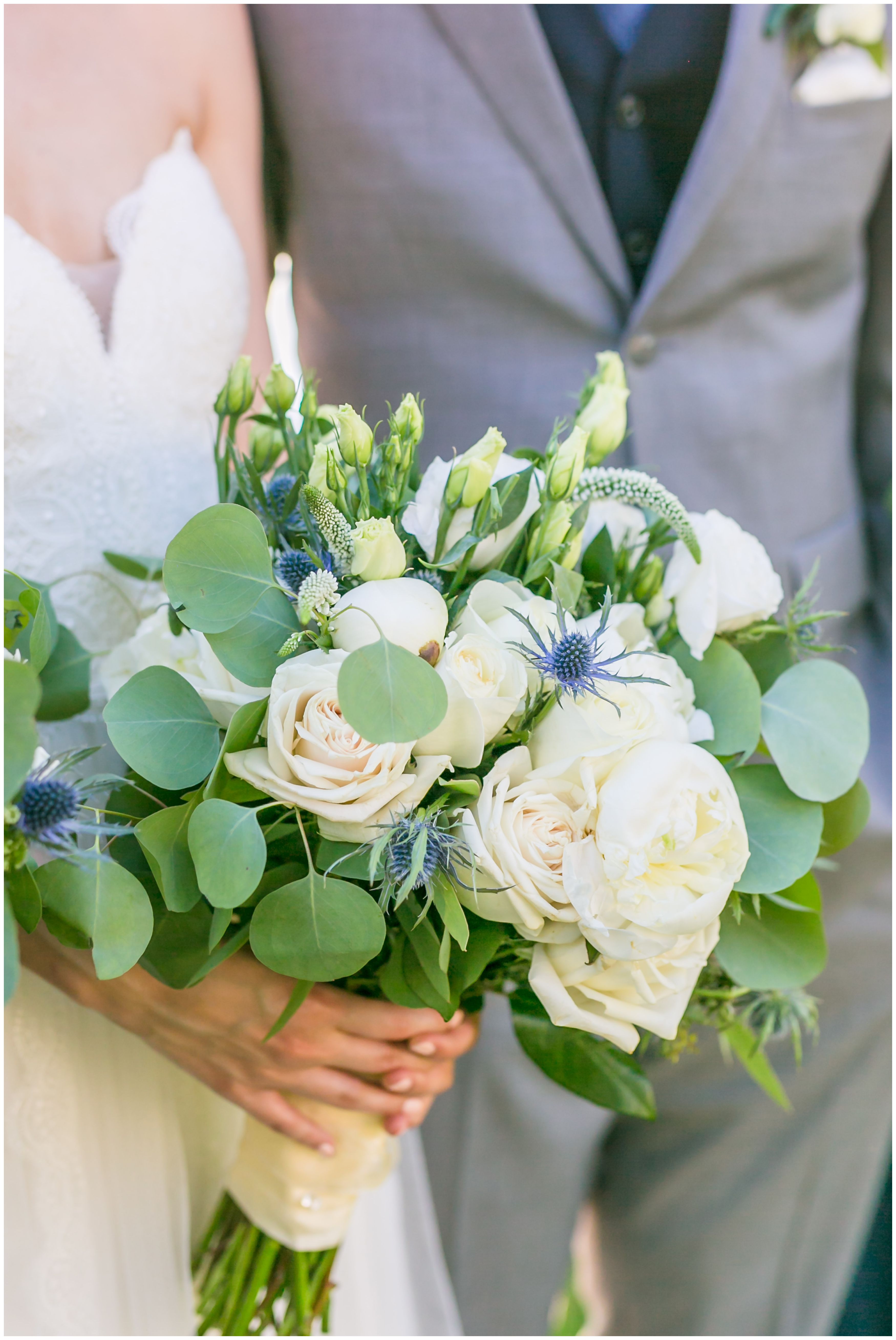 Bride and groom with white peony and rose bridal bouquet