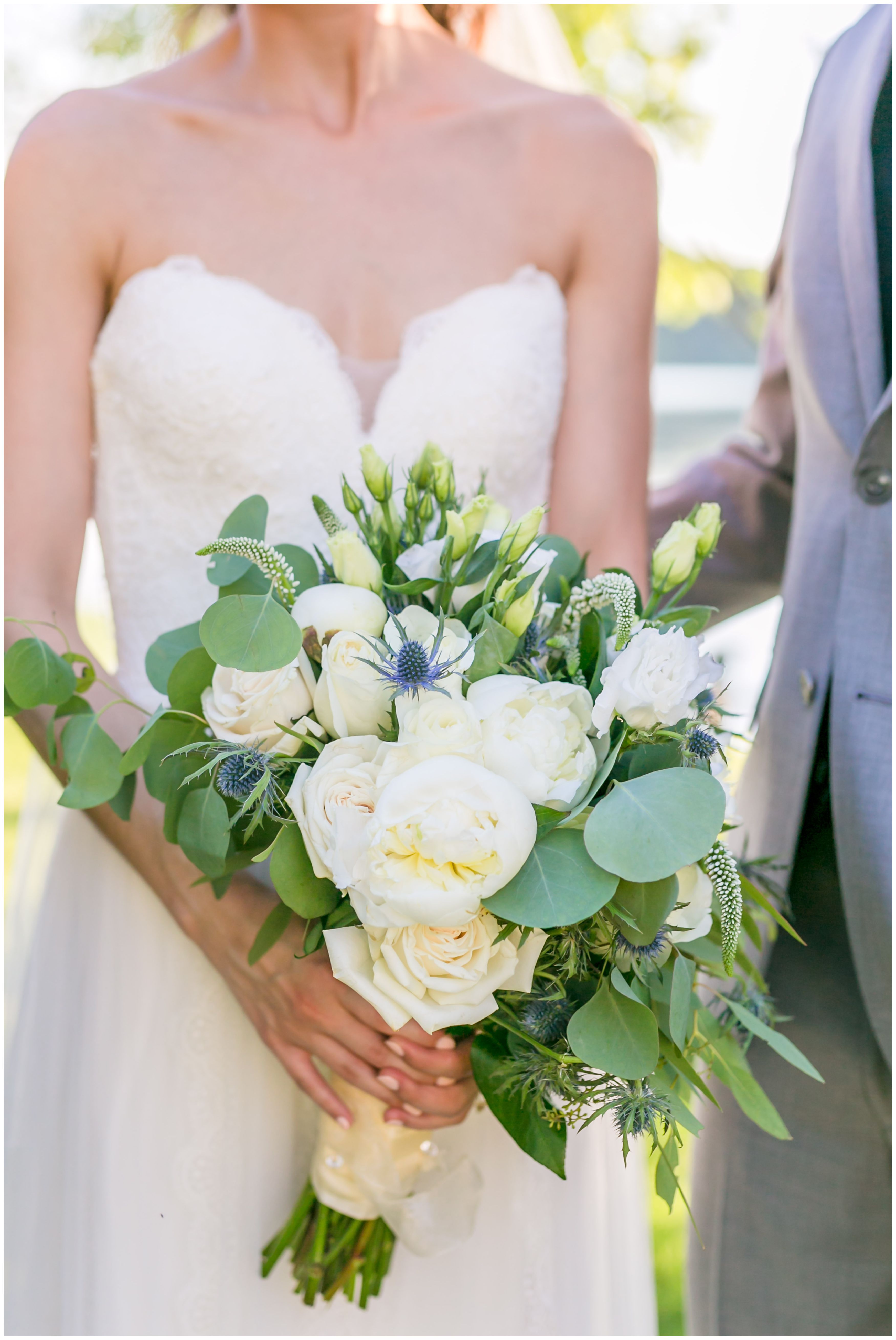 Bridal Bouquet white peonies and white roses with bride and groom