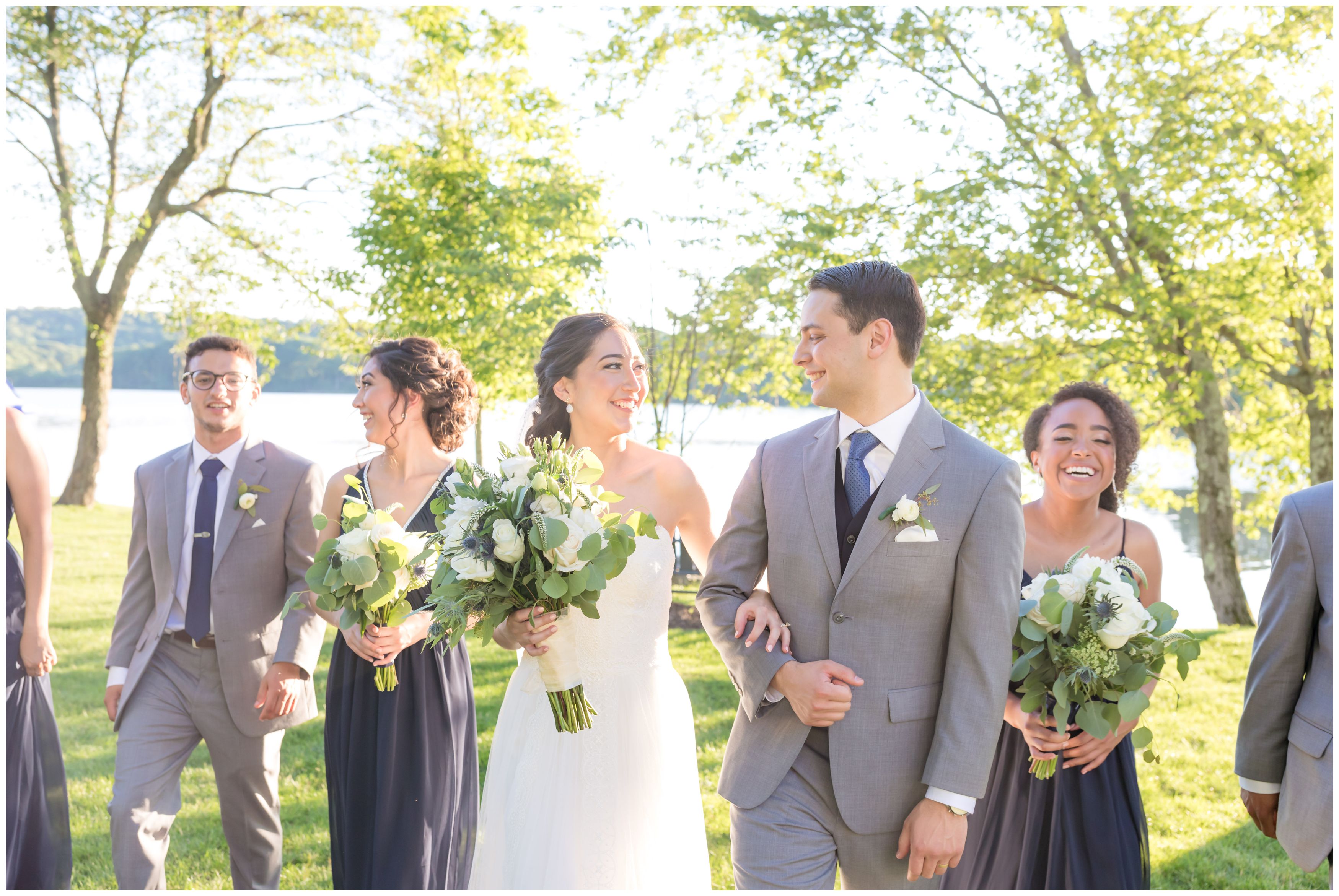 Bride and groom and bridal party at outdoor lakeside wedding