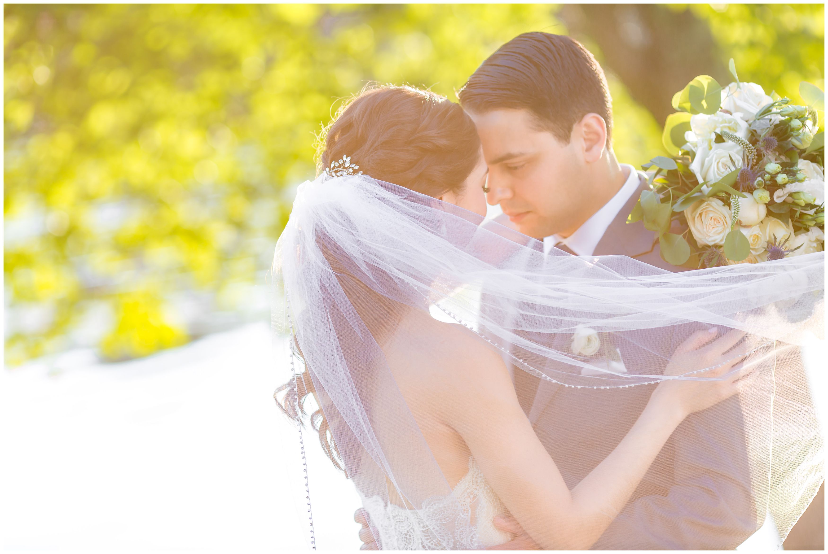 Bride and groom portraits at outdoor lakeside wedding