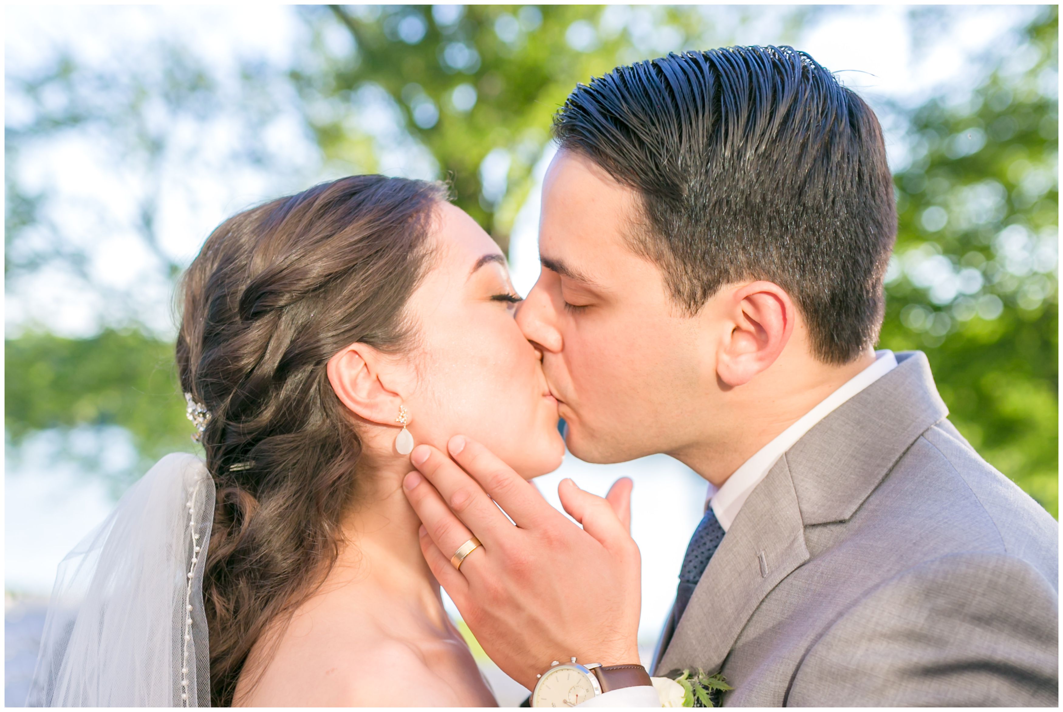 Bride and groom portrait kiss