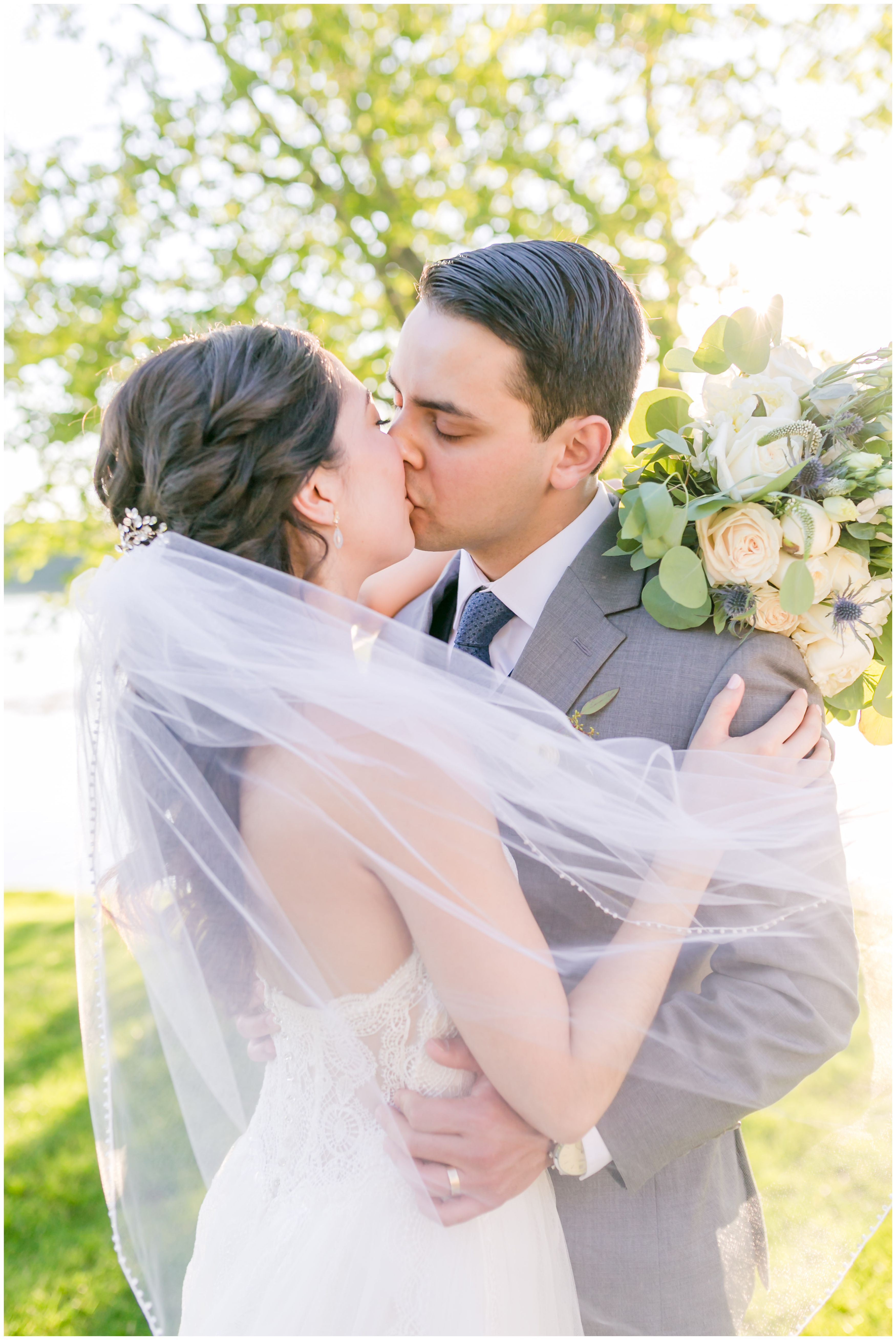 Bride and groom portrait kiss at golden hour at Indian Trail Club