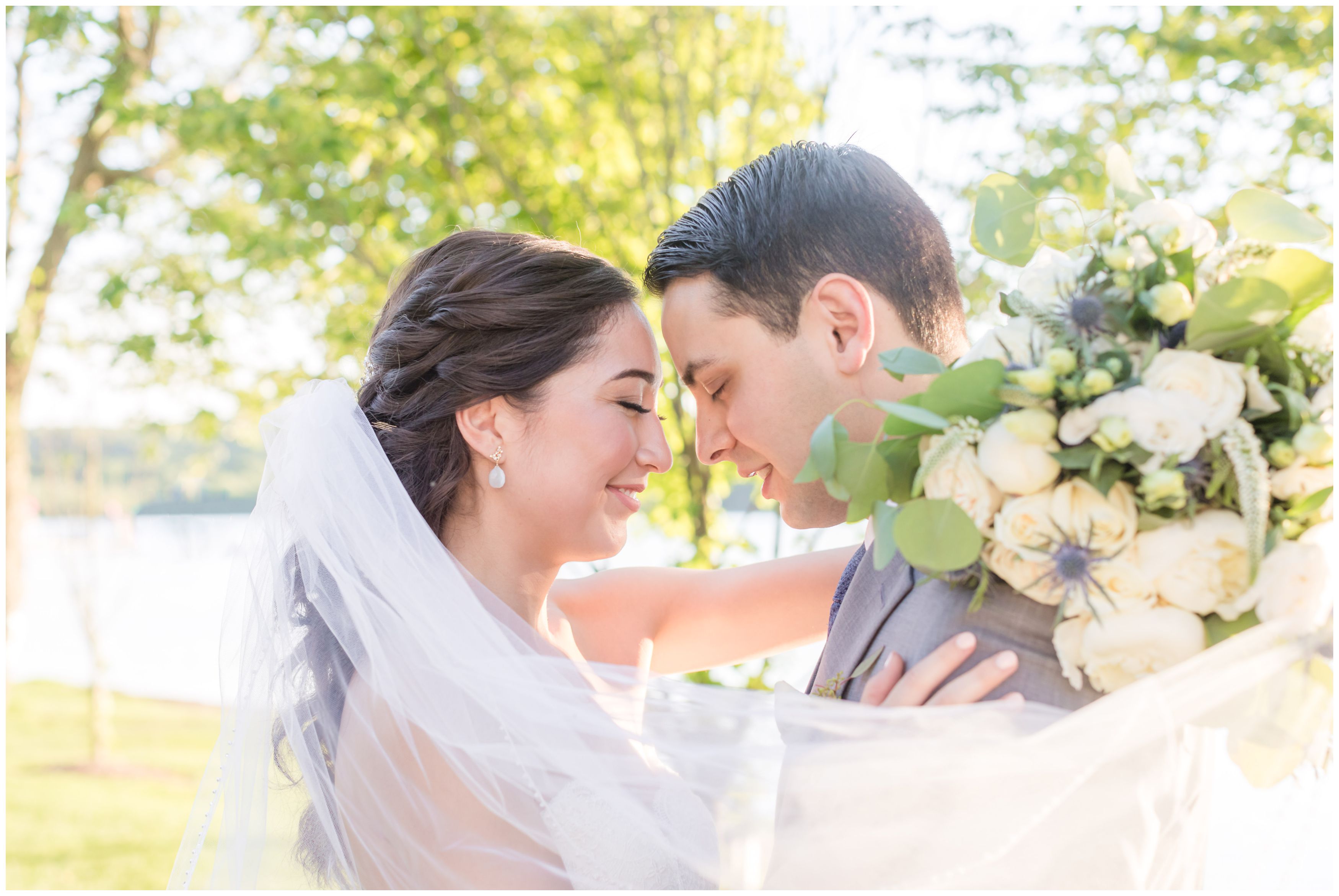 Bride and groom portraits at outdoor lakeside wedding