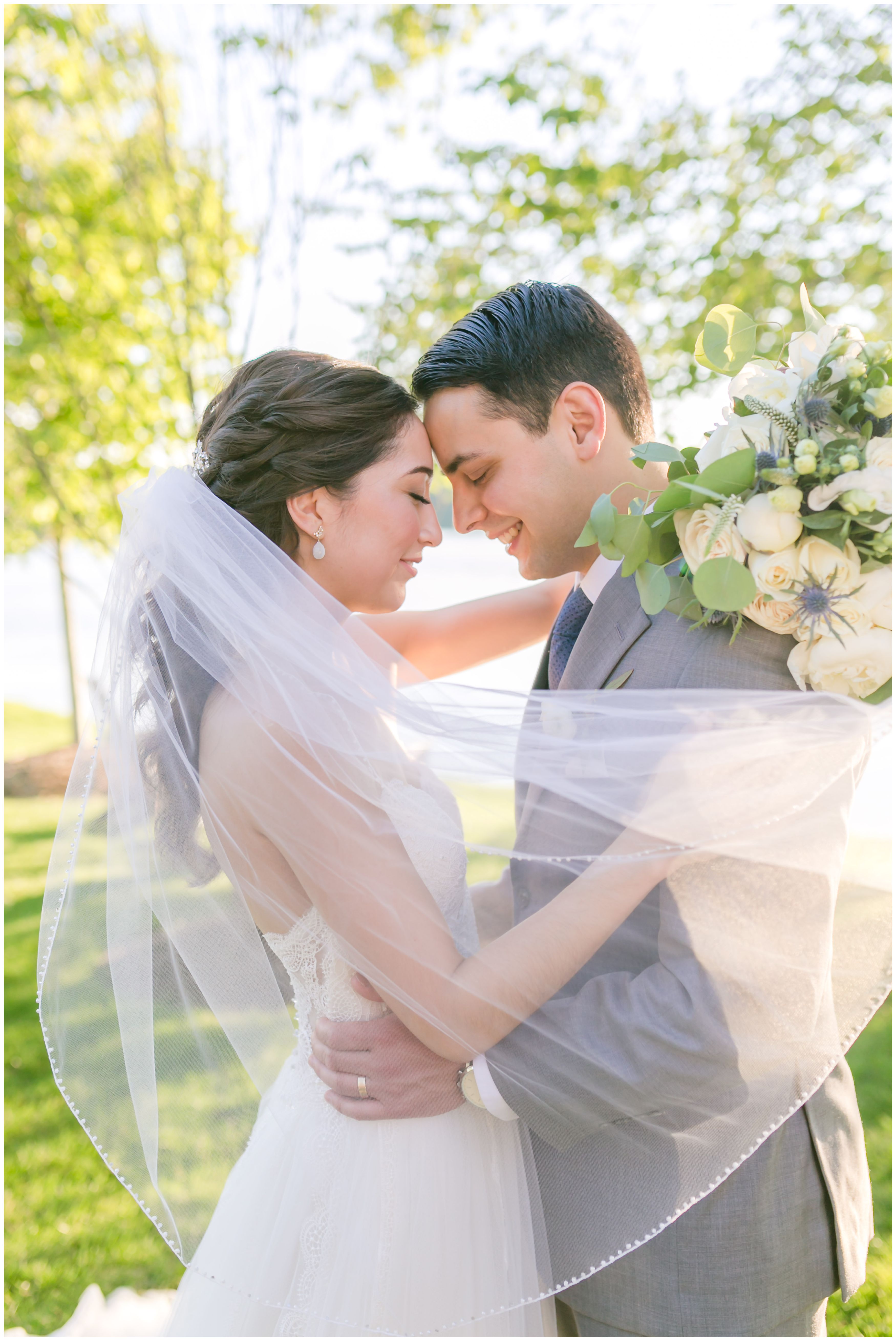 Bride and groom portrait at outdoor lakeside summer wedding at Indian Trail Club