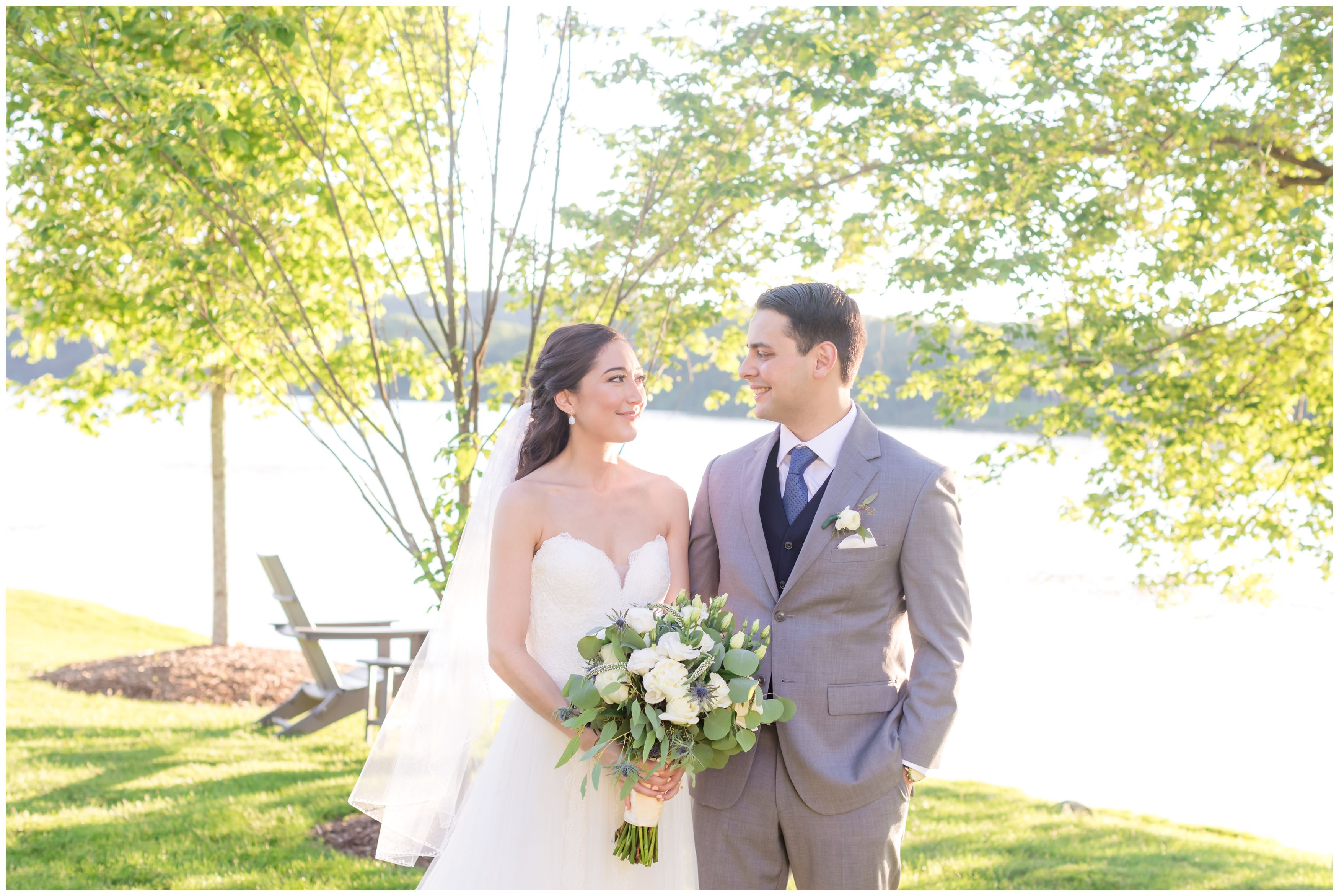 Bride and groom classic wedding portrait at outdoor lakeside summer wedding