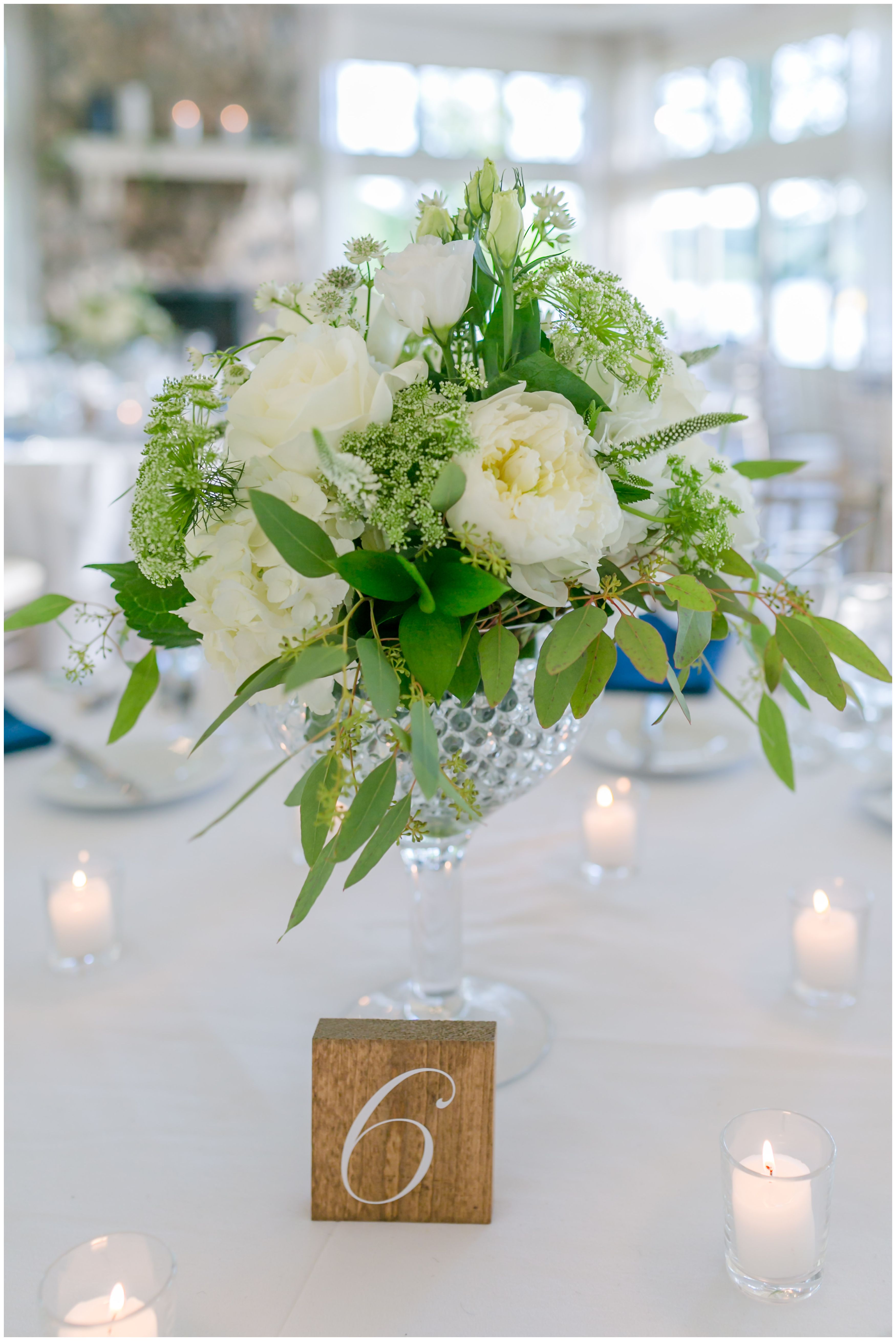 White peonies centerpiece with candle light at Indian Trail Club