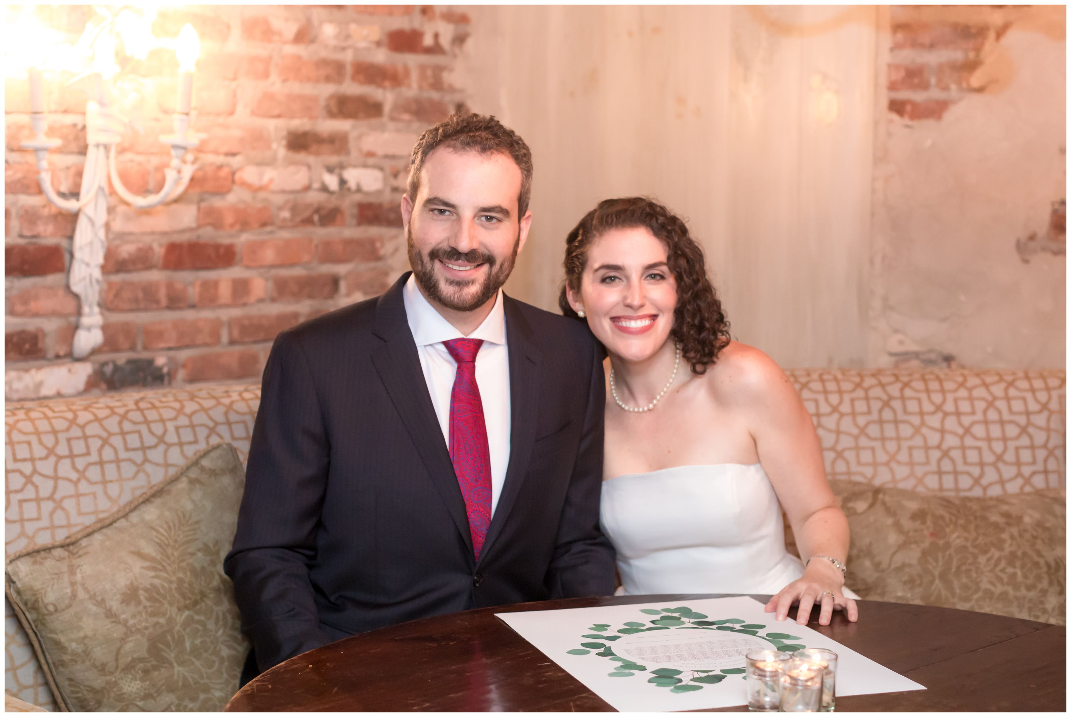 Bride and groom signing the Ketubah at the Bernards Inn